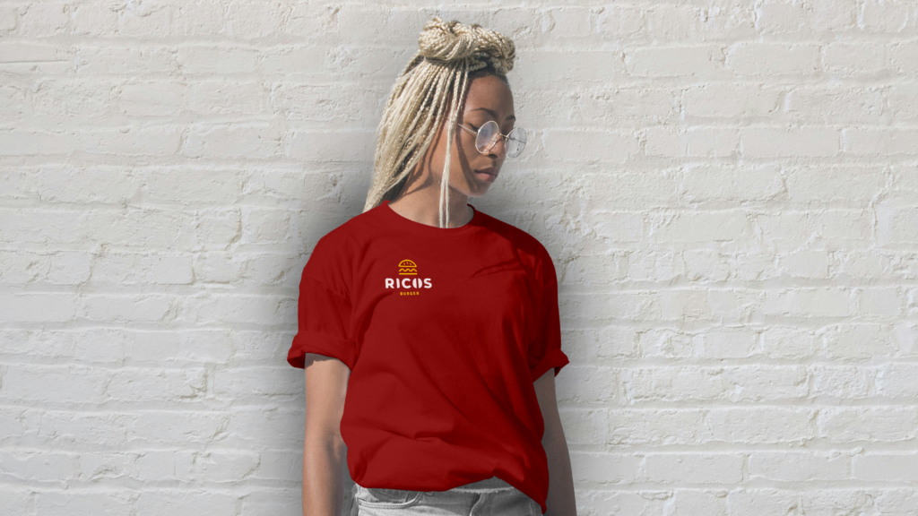 Mock-up for Ricos burger t-shirts. red t-shirt with the logo being placed on the top right side of the shirt
